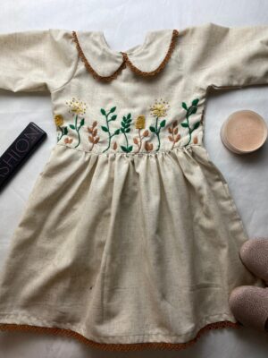 LIGHT TAN COLOR GIRLS FROCK WITH HAND CRAFTD BODY