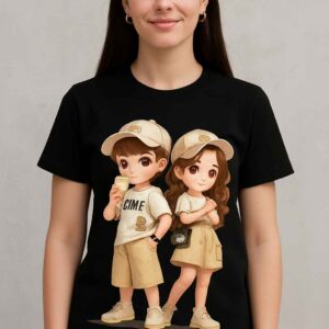 White T‑shirt with cute cartoon boy and girl graphic, worn by a child model – Mini Me Kids Wear Black T‑shirt with cute cartoon boy and girl graphic, worn by a child model – Mini Me Kids Wear