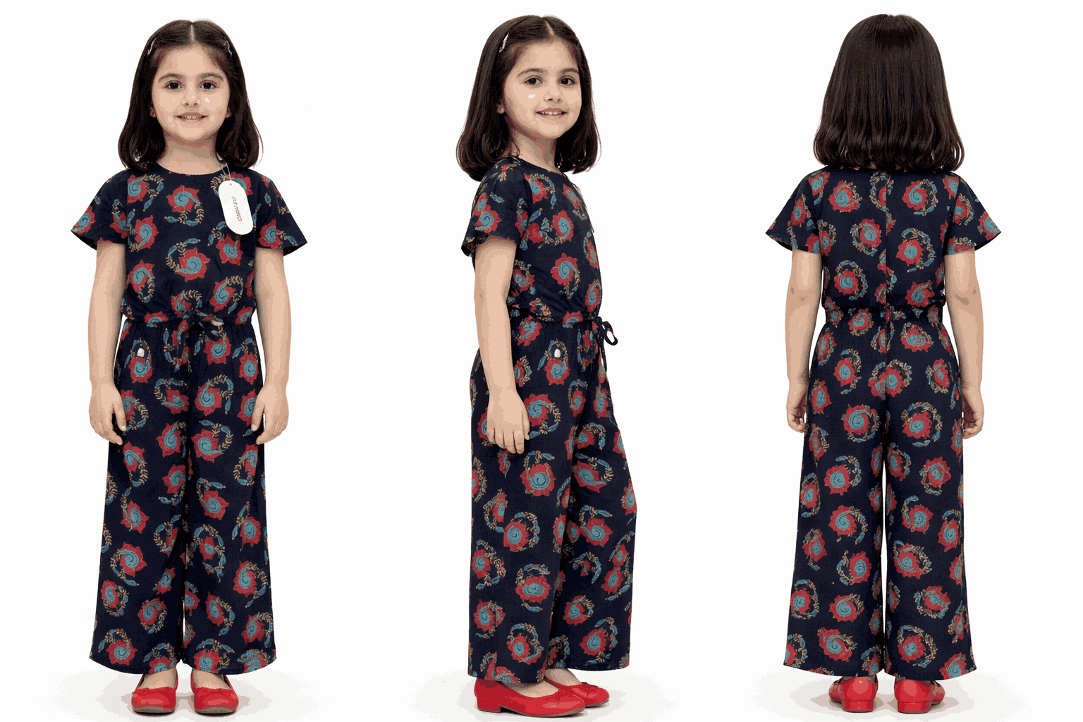 Girl wearing navy blue floral printed jumpsuit with wide leg design and elastic waist summer outfit for kids